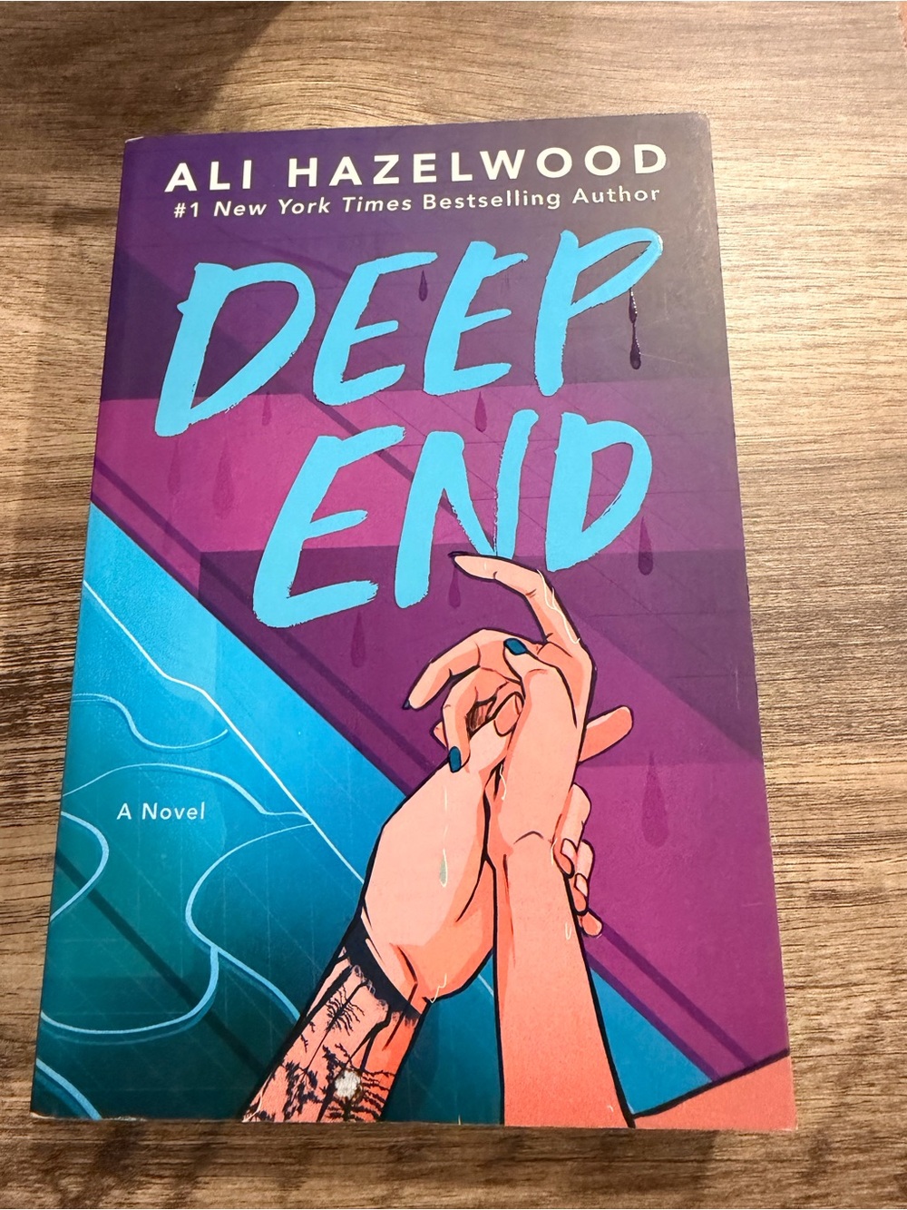 Deep End by Ali Hazelwood - Purple & Teal Paperback Novel